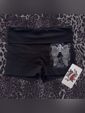 Urban Weekend black shorts with silver rhinestone angel wings and fleur delis